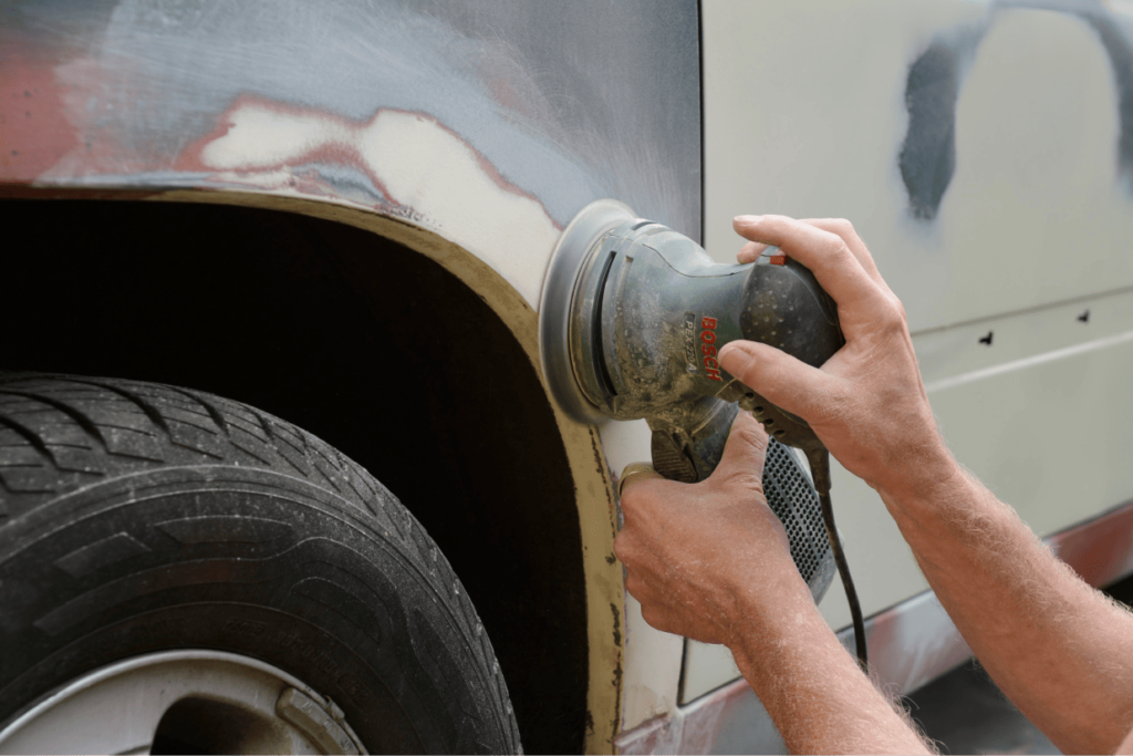 germany-zeuthen-man-mending-car-paint-2024-09-18-15-59-41-utc 1